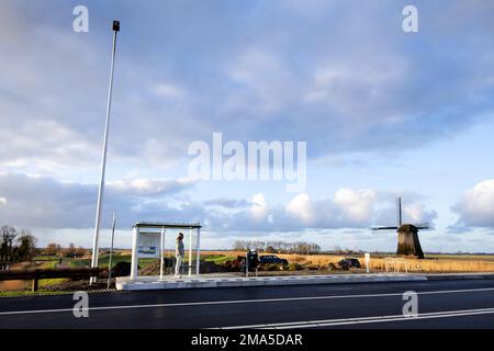 SCHERMERHORN - A man is waiting for the bus that never came. Thousands of bus drivers, drivers and conductors in regional transport will stop working on Thursday and Friday. ANP OLAF KRAAK netherlands out - belgium out Stock Photo