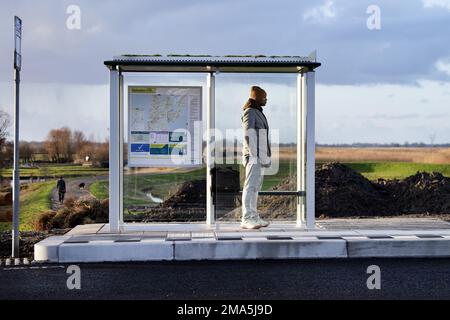 SCHERMERHORN - A man is waiting for the bus that never came. Thousands of bus drivers, drivers and conductors in regional transport will stop working on Thursday and Friday. ANP OLAF KRAAK netherlands out - belgium out Stock Photo