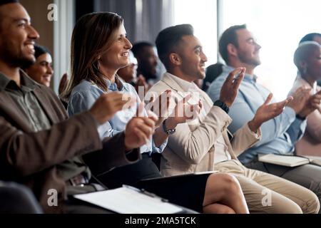 Winners applaud each other. a group of young businesspeople clapping during a conference in a modern office. Stock Photo
