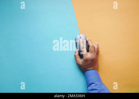 Businessman hand with computer mouse, Close up Stock Photo