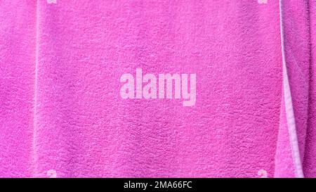 Pink texture of bath towel folded as a background Stock Photo
