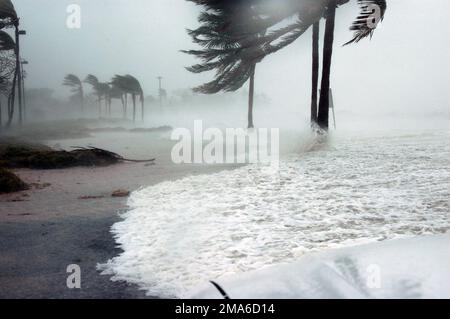 The Gulf of Mexico spills over an oceanfront road at Naval Air Station (NAS) Key West Truman Annex as Hurricane Dennis passes the southernmost tip of the base Saturday morning. The storm center passed within 125 miles of the base, clocking winds in excess of 90 miles an hour and dumping more than seven inches of rain before moving north through the Gulf of Mexico. The Gulf of Mexico spills over an oceanfront road at Naval Air Station (NAS) Key West Truman Annex as Hurricane Dennis passes the southernmost tip of the base Saturday morning. The storm center passed within 125 miles of the base, cl Stock Photo