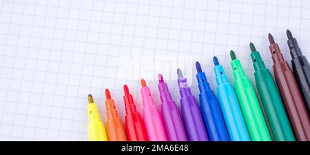 Colorful felt-tip pens on a notebook Stock Photo