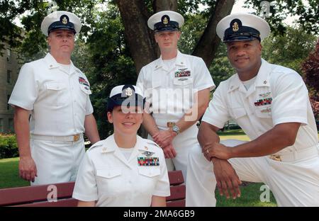 The US Navy (USN) 2005 Sailors of the Year (SOY) pose in the Pentagon courtyard following their meritorious advancement to CHIEF PETTY Officer. Pictured left-to-right, CHIEF Utilitiesman (UTC) Thomas E. Mock; CHIEF Hospital Corpsman (HMC) Shannon R. Dittlinger; CHIEF Aviation Electronics Technician (AEC)) Matthew J. Waxenfelter and CHIEF Aerographer's Mate (AGC) Richard B. Rainer. Base: Washington State: District Of Columbia (DC) Country: United States Of America (USA) Stock Photo