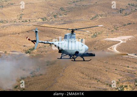 050725-O-0000X-001. [Complete] Scene Caption: Northrop Grumman's RQ-8A Fire Scout Vertical Takeoff and Landing Tactical Unmanned Aerial Vehicle (VTUAV) test fires the second of two Mark (MK) 66 2.75-inch unguided rockets during weapons testing at Arizona's Yuma Proving Grounds. The Fire Scout has the ability to autonomously take off and land from any aviation-capable warship and at unprepared landing zones, with an on-station endurance of over four hours. The Fire Scout system is capable of continuous operations, providing coverage at 110 nautical miles from the launch site. Utilizing a baseli Stock Photo