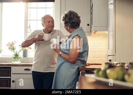 They love having coffee together. a senior couple having breakfast together at home. Stock Photo