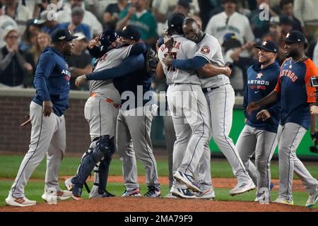 Houston Astros players celebrate after defeating the Seattle Mariners in the 18th inning in Game 3 of an American League Division Series baseball game Saturday, Oct. 15, 2022, in Seattle. (AP Photo/Stephen Brashear)