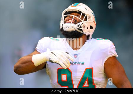 Miami Dolphins defensive tackle Christian Wilkins (94) cheers after scoring  a touchdown, during the first half at an NFL football game against the  Cincinnati Bengals, Sunday, Dec. 22, 2019, in Miami Gardens