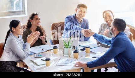 Welcome onboard. a group of colleagues having a meeting in a boardroom at work. Stock Photo