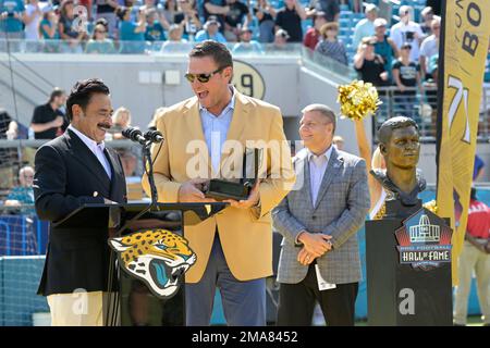 Former Jacksonville Jaguars offensive tackle Tony Boselli, center, stands  with members of his family after a ceremony, where he was presented with  his Pro Football Hall of Fame ring and had his