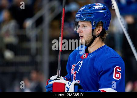 New York Rangers defenseman Zac Jones (6) checks New Jersey Devils' Brian  Pinho during the first period of an NHL preseason hockey game Friday, Sept.  30, 2022, in Newark, N.J. (AP Photo/Noah