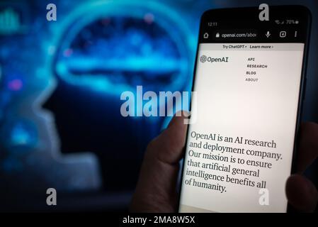 Mobille device with information about OpenAI and ChatGPT - an artificial intelligence company Stock Photo