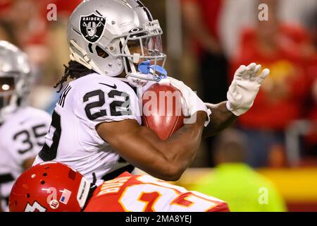 KANSAS CITY, MO - NOVEMBER 06: Kansas City Chiefs safety Deon Bush (26)  hits Tennessee Titans running back Hassan Haskins (25) on November 6th,  2022 at GEHA field at Arrowhead Stadium in