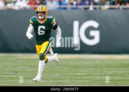 Green Bay Packers safety Dallin Leavitt (6) celebrates with teammates after  making an interception during a