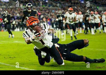 Cincinnati Bengals' Ja'Marr Chase, left, catches a pass over Baltimore  Ravens' Marlon Humphrey during the second half of an NFL football game,  Sunday, Oct. 9, 2022, in Baltimore. (AP Photo/Julio Cortez Stock