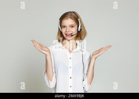 woman with headset is consulting clients online. Stock Photo