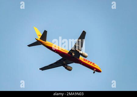 DHL Boeing 757-200F plane flying overhead approaching Lisbon, Portugal. Stock Photo