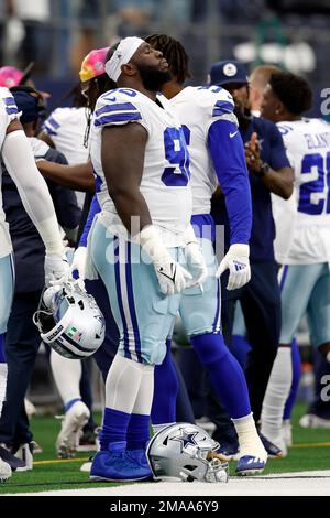 Washington Commanders defensive tackle Daron Payne (94) wears an  international flag decal and a Crucial Catch logo on his helmet during an  NFL football game against the Dallas Cowboys, Sunday, Oct. 2