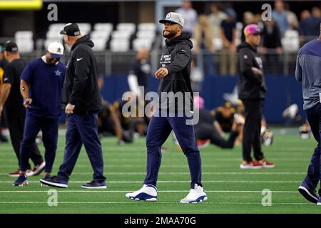 FILE - Washington Commanders helmets with Guardian Caps sit on the field  during practice at the team's NFL football training facility, Saturday,  July 30, 2022 in Ashburn, Va. The mushroom-like contraptions NFL