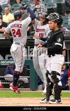 Chicago White Sox catcher Carlos Perez and second baseman Josh Harrison  celebrate the team's 3-2 win over the Minnesota Twins after a baseball game  Monday, Oct. 3, 2022, in Chicago. (AP Photo/Charles