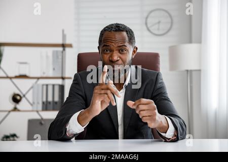 African American businessman holding an online consultation. Webcam headshot portrait. Online webinar, internet communication. Distant work. Stock Photo