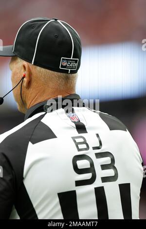 NFL official, back judge Scott Helverson (93) wearing a crucial