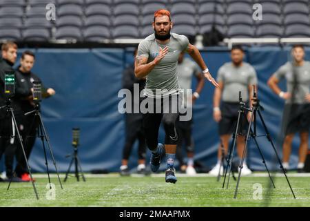 Defensive lineman Jaime Humberto Jiron Bowles, of Panama, runs the