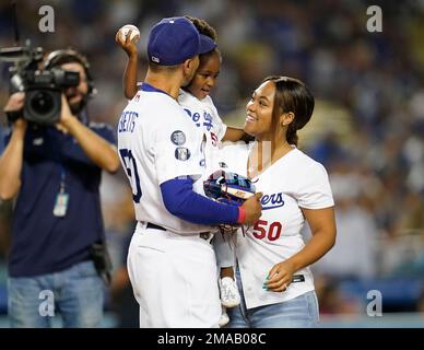 Kynlee Betts, center, greets her father, Los Angeles Dodgers right fielder Mookie  Betts (50), after she