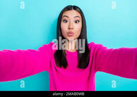 Photo of lovely nice lady wear pink stylish clothes recording video live streaming isolated on cyan color background Stock Photo