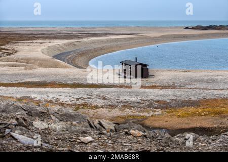 Bamsebu hut built for Beluga whaling now in private ownership name means Teddy Bear Hut Ahlstandshalvøya Spitsbergen Norway archipelago. Expedition cr Stock Photo