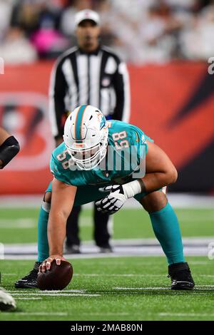 Miami Dolphins guard Connor Williams (58) hikes the ball during a