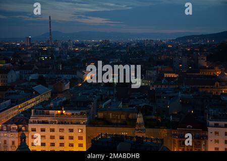 26.05.2016, Croatia, Zagreb, Zagreb - View of part of the city center in the evening twilight with the chimney of a power station. 00A160526D250CAROEX Stock Photo