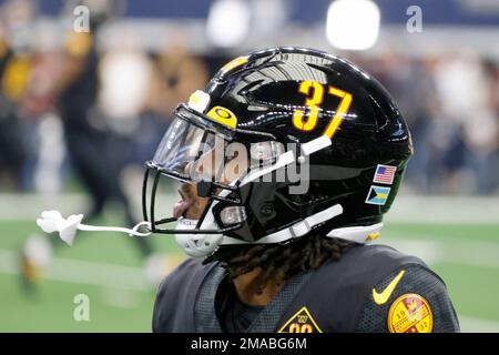 Washington Commanders cornerback Rachad Wildgoose (37) displays a US and  Bahamas flag decal on his helmet during an NFL Football game in Arlington,  Texas, Sunday, Oct. 2, 2022. (AP Photo/Michael Ainsworth Stock