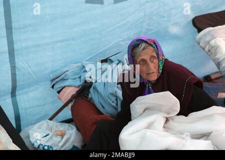 13.04.2022, Ukraine, Oblast, Lviv - Ukrainian war refugees gather in front of Lviv main station. Portrait of an old woman in a Red Cross tent. Attenti Stock Photo