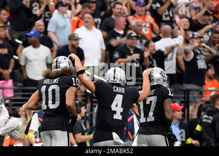 Las Vegas Raiders wide receiver Zay Jones #12 celebrates with running back  Jalen Richard #30, quarterback Derek Carr #4, wide receivers Hunter Renfrow  #13 and Nelson Agholor #15 after scoring a touch