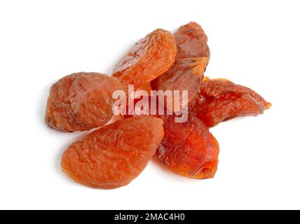 Whole Sun-dried apricots without stones. Isolated on white background. Stock Photo