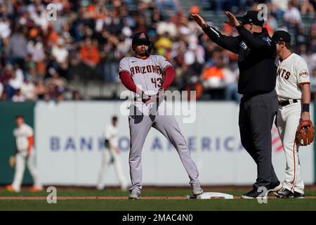 Arizona Diamondbacks' Sergio Alcantara (43) fields a grand out hit by St.  Louis Cardinals Tyler O'Neill during the fourth inning of a baseball game,  Friday, Aug. 19, 2022, in Phoenix. (AP Photo/Matt