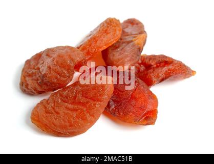 Whole Sun-dried apricots without stones. Isolated on white background. Stock Photo