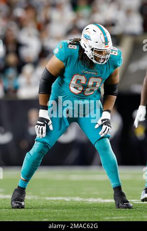 Miami Dolphins offensive lineman Robert Jones smiles on the field