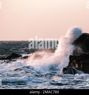 Waves crashing against the rocks Stock Photo
