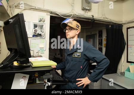 220525-N-DU622-1006 PACIFIC OCEAN (May 25, 2022) Legalman 2nd Class Spencer Englert, from Wichita, Kan., drafts reports aboard the aircraft carrier USS Nimitz (CVN 68). Nimitz is underway in the U.S. 3rd Fleet area of operations. Stock Photo