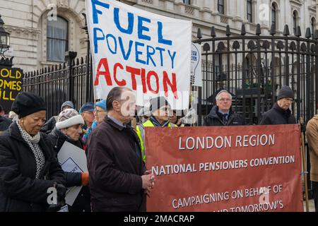 London, England, UK 19/01/2023 Protesters from Fuel Poverty Action gather in Westminster and hold a minutes silence to remember those that have lost their lives this and every winter due to cold and damp homes. They then held a 'funeral march' to Downing Street where they laid the coffin which donned the numbers 13400, the number of excess deaths this year. Speakers included Labour MP John McDonnell and Baron Prem Sikka Stock Photo