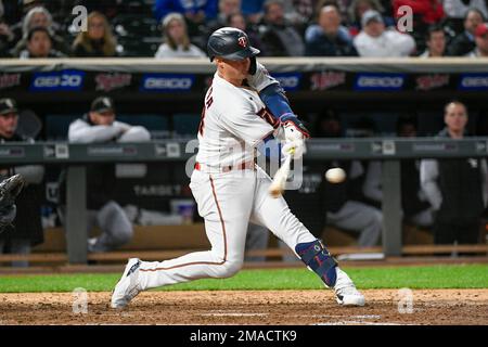 Minnesota Twins' Jose Miranda hits a two RBI double against the