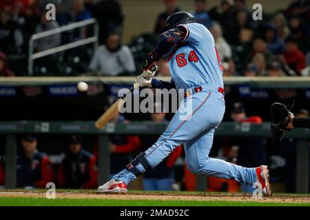 Minnesota Twins' Jose Miranda hits a two RBI double against the