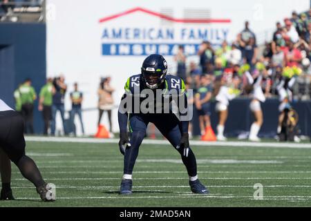 Seattle Seahawks defensive end Darrell Taylor (52) and defensive end L.J.  Collier celebrate during the first half of an NFL football game against the  Los Angeles Rams, Thursday, Oct. 7, 2021, in