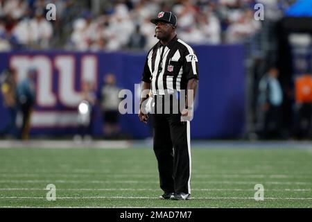 Field judge Michael Banks (72) wears a Salute To Service emblem on