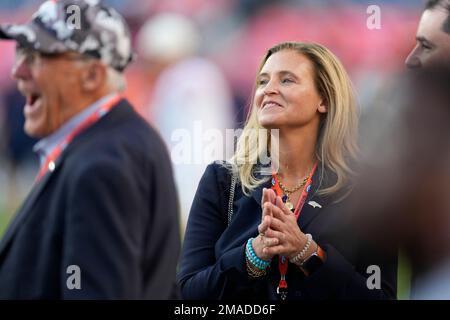 San Francisco 49ers chief executive officer Jed York, middle, talks with Denver  Broncos owners Carrie Walton Penner, left, and Rob Walton before an NFL  football game in Denver, Sunday, Sept. 25, 2022. (