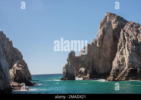 The Cabo Arch is perhaps the most famous landmark in Cabo San Lucas, Mexican Riviera, Mexico. It is only reachable via boat and sits at Land's End. Stock Photo