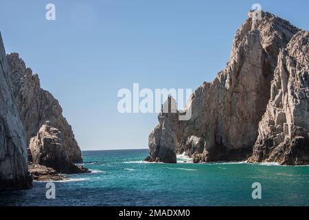 The Cabo Arch is perhaps the most famous landmark in Cabo San Lucas, Mexican Riviera, Mexico. It is only reachable via boat and sits at Land's End. Stock Photo