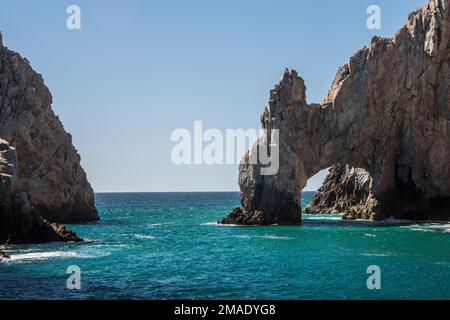 The Cabo Arch is perhaps the most famous landmark in Cabo San Lucas, Mexican Riviera, Mexico. It is only reachable via boat and sits at Land's End. Stock Photo